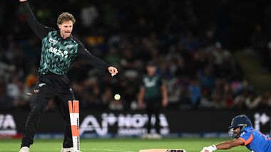 New Zealand's Lockie Ferguson (L) reacts as India's Nitish Kumar Reddy successfully makes a run during the second T20I in Christchurch on Saturday.