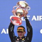 Race winner Red Bull Racing's Dutch driver Max Verstappen lifts his trophy during podium ceremony of the Formula One Bahrain Grand Prix.