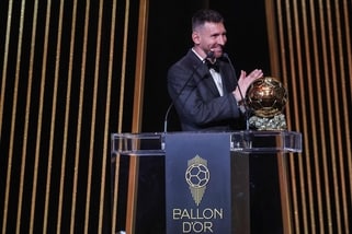 Legendary Argentina player Lionel Messi gestures on stage as he receives his 8th Ballon d'Or award during the 2023 Ballon d'Or France Football award ceremony in Paris.