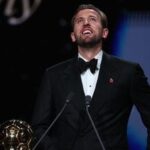 England and Bayern Munich forward Harry Kane reacts after receiving the Ballon d'Or award during a ceremony in London on Monday.