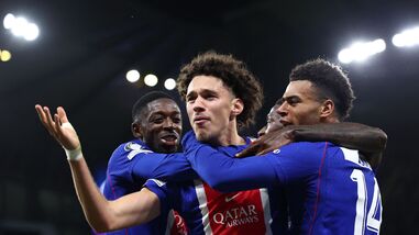 Paris Saint-Germain's French midfielder #11 Maghnes Akliouche (C) celebrates with teammates after scoring his team's fourth goal in their UEFA Champions League match against Manchester City on Wednesday.