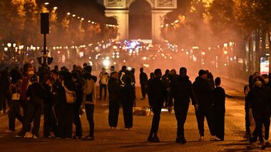 Protesters gather on the Champs-Elysees Avenue with the Arc de Triomphe in the background during a demonstration to protest against the high cost of living, in Paris on October 17, 2026. (Photo by Guillaume Saligot / AFP)