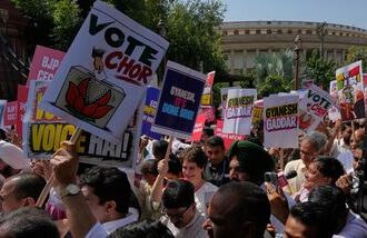 Congress party leader Priyanka Gandhi Vadra, center, and others hold placards as they march during a protest organized by opposition parties demanding the resignation of the country's election chief Gyanesh Kumar in New Delhi, India, Tuesday, Oct. 6, 2026. (AP Photo/Manish Swarup)