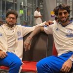 India's Kuldeep Yadav (L) and Tilak Varma on their way to New Zealand.