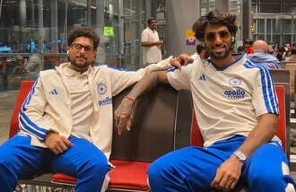 India's Kuldeep Yadav (L) and Tilak Varma on their way to New Zealand.