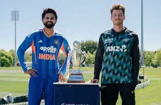 Indian captain Shreyas Iyer (L) and New Zealand captain Mitchell Santner pose with the trophy ahead of the first T20I.
