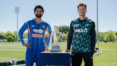 Indian captain Shreyas Iyer (L) and New Zealand captain Mitchell Santner pose with the trophy ahead of the first T20I.