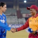 Indian captain Smriti Mandhana (L) and her Zimbabwean counterpart Josephine Nkomo.