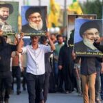 Supporters of Iran-aligned armed factions march with portraits of Iran's slain supreme leader Ali Khamenei, Lebanese Hezbollah movement's slain leader Hassan Nasrallah, and Iraq's supreme Shia Muslim cleric Ayatollah Ali Sistani, during a rally celebrating the withdrawal of forces of the US-led coalition against the Islamic State from Iraq, in Baghdad on September 30, 2026.(Photo by AHMAD AL-RUBAYE / AFP)