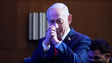 Israeli Prime Minister Benjamin Netanyahu greets his supporters at Likud party headquarters in Jerusalem after the release of the first exit poll results in Israel's general election, Wednesday, Oct. 28, 2026.