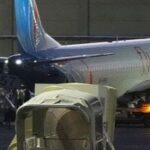 People disembark from a FlyDubai carrying Israeli passengers who had earlier been aboard another FlyDubai aircraft that made an emergency landing in Saudi Arabia approaches Ben Gurion International Airport near Tel Aviv, Israel, Wednesday, Sept. 30, 2026. (AP Photo/Ariel Schalit)