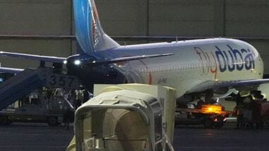 People disembark from a FlyDubai carrying Israeli passengers who had earlier been aboard another FlyDubai aircraft that made an emergency landing in Saudi Arabia approaches Ben Gurion International Airport near Tel Aviv, Israel, Wednesday, Sept. 30, 2026. (AP Photo/Ariel Schalit)