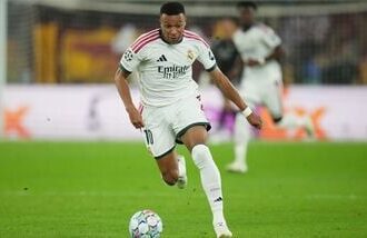 Real Madrid's Kylian Mbappe controls the ball during a Champions League opening phase soccer match between Roma and Real Madrid, in Rome.