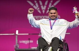 India's Jhandu Kumar celebrates after winning the bronze medal during the medal ceremony for the men's heavyweight para powerlifting event at the Commonwealth Games 2026, in Glasgow, Friday (PTI)