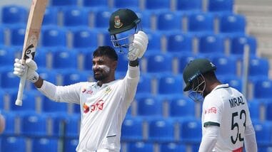 Litton Das (L) of Bangladesh celebrates his hundred against Afghanistan in the one-off Test in Abu Dhabi.