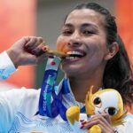 Gold medallist India's Lovlina Borgohain poses for photographers during the medal ceremony for the women's 75kg boxing event at the 20th Asian Games 2026.