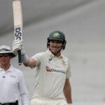Australia's Matt Renshaw raises his bat to celebrate fifty on day 2 of the first Test against South Africa in Durban.