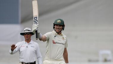 Australia's Matt Renshaw raises his bat to celebrate fifty on day 2 of the first Test against South Africa in Durban.