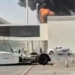 This image from video obtained and verified by AP shows thick black smoke and flames rising from a fire at King Khalid International Airport in Riyadh, Saudi Arabia, Friday, Oct. 9, 2026. (UGC via AP)