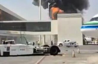 This image from video obtained and verified by AP shows thick black smoke and flames rising from a fire at King Khalid International Airport in Riyadh, Saudi Arabia, Friday, Oct. 9, 2026. (UGC via AP)