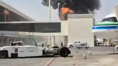 This image from video obtained and verified by AP shows thick black smoke and flames rising from a fire at King Khalid International Airport in Riyadh, Saudi Arabia, Friday, Oct. 9, 2026. (UGC via AP)
