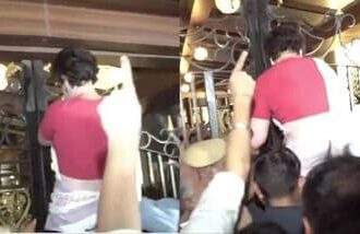 Priyanka Gandhi climbs a gate after being detained