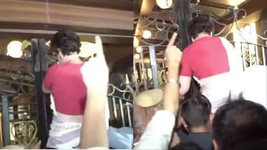 Priyanka Gandhi climbs a gate after being detained