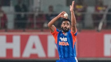 India's Naman Dhir bowls during the second T20I against West Indies.
