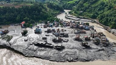 A drone view shows mud covering buildings and property following devastating floods at Trishuli in Nuwakot district, Nepal, on August 27, 2026. REUTERS/Navesh Chitrakar