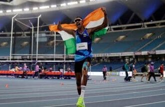 India's Nishad Kumar celebrates winning gold in the men's long jump T47 event at the 2026 Asian Para Games in Nagoya.