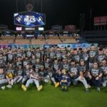 The Milwaukee Brewers pose for a team photo after Game 4 of baseball's National League Championship Series between the Milwaukee Brewers and the Los Angeles Dodgers.