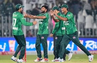 Pakistan's Muhammad Imran, center, celebrates with teammates after taking the wicket of Sri Lanka's Kamil Mishara during the first T20 cricket match between Pakistan and Sri Lanka.