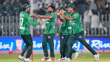 Pakistan's Muhammad Imran, center, celebrates with teammates after taking the wicket of Sri Lanka's Kamil Mishara during the first T20 cricket match between Pakistan and Sri Lanka.