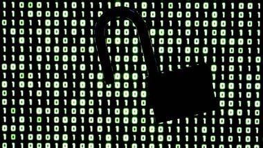 TOPSHOT - An illustration picture, showing a padlock in front of binary code on a laptop screen