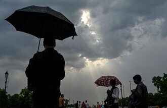 Rain clouds hover over the Kartavya Path in New Delhi