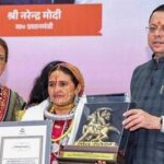 Uttarakhand Chief Minister Pushkar Singh Dhami, accompanied by Cabinet Minister Rekha Arya, presents the 'Veerangana Teelu Rauteli Award' to an awardee during a felicitation ceremony on the occasion of the birth anniversary of legendary warrior Teelu Rauteli, in Dehradun, Uttarakhand. (@pushkardhami/X via PTI Photo)(PTI08_08_2026_000380B)