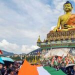 Tawang: Participants carry a 100-metre-long national tricolour near the Giant Buddha Statue during a 'Tiranga Yatra' organized as part of the 'Har Ghar Tiranga' campaign ahead of Independence Day celebrations, in Tawang, Arunachal Pradesh, Wednesday, Aug. 12, 2026. (PTI Photo)(PTI08_12_2026_000396B)