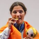 India's Neeru Dhanda poses with her gold medal and the event mascot during the victory ceremony for the women's trap shooting individual event at Asian Games 2026 in Nagoya.