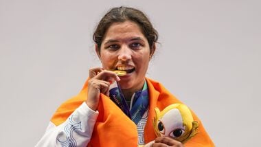 India's Neeru Dhanda poses with her gold medal and the event mascot during the victory ceremony for the women's trap shooting individual event at Asian Games 2026 in Nagoya.