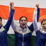 India's Manisha Keer (Left), Ashima Ahlawat (Centre) and Neeru Dhanda (Right) pose with the national flag after winning the silver medal during the victory ceremony for the women's trap shooting team event at Asian Games 2026 in Nagoya.