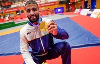 Nagoya: India's Sujeet Kalkal poses for photographs after winning gold medal in the men's Freestyle 65 kilogram final bout 196 wrestling event in the ongoing Asian Games 2026, in Nagoya, Japan.