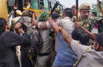 Police personnel detain demonstrators during a demonstration call by the Cockroach Janta Party (CJP) demanding the resignation of Chief Election Commissioner (CEC) Gyanesh Kumar over alleged electoral roll irregularities, in New Delhi, Saturday, Oct. 10, 2026. (PTI Photo/Karma Bhutia)