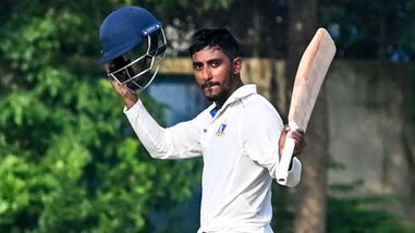 Bengal's Sudip Gharami celebrates his half century during the second day of the Ranji Trophy cricket match against Delhi in Kolkata.