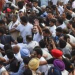 New Delhi: Congress leader Rahul Gandhi greets and moves along with supporters during 'March for Democracy' by INDIA bloc leaders, towards the Supreme Court, to file a petition against Chief Election Commissioner Gyanesh Kumar and 'vote chori', in New Delhi, Monday, Oct. 12, 2026