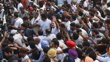 New Delhi: Congress leader Rahul Gandhi greets and moves along with supporters during 'March for Democracy' by INDIA bloc leaders, towards the Supreme Court, to file a petition against Chief Election Commissioner Gyanesh Kumar and 'vote chori', in New Delhi, Monday, Oct. 12, 2026
