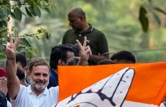 New Delhi: Congress leader Rahul Gandhi and other INDIA bloc leaders proceed in a vehicle towards the Supreme Court to file a petition against Special Intensive Revision (SIR) of electoral rolls and alleged poll irregularities during 'March for Democracy', in New Delhi, Monday, Oct. 12, 2026. NSUI President Vinod Jakhar is also seen. (PTI Photo/Arun Sharma) (PTI10_12_2026_000412A)
