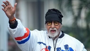 Bollywood actor Amitabh Bachchan greets fans at his residence Jalsa