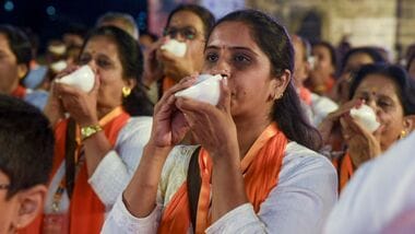 Nashik: Participants blow conch shells on the banks of the Godavari River to set a Guinness World Record during preparations for the Nashik-Trimbakeshwar Simhastha Kumbh Mela, in Nashik, Sunday, Oct. 25, 2026. A total of 501 people blew conch shells simultaneously during the event.