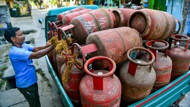 Siliguri: A delivery worker arranges domestic LPG cylinders on a commercial vehicle for distribution to households, in Siliguri, Monday, Oct. 26, 2026.