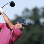 Scottie Scheffler of the US Team plays his shot from the sixth tee during Sunday's Singles on day four of the Presidents Cup 2026 at Medinah Country Club on September 27, 2026 in Medinah, Illinois.